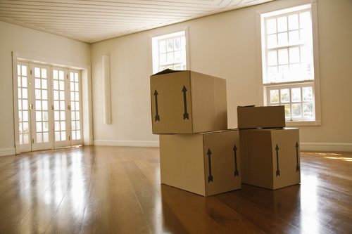 Moving boxes in empty room